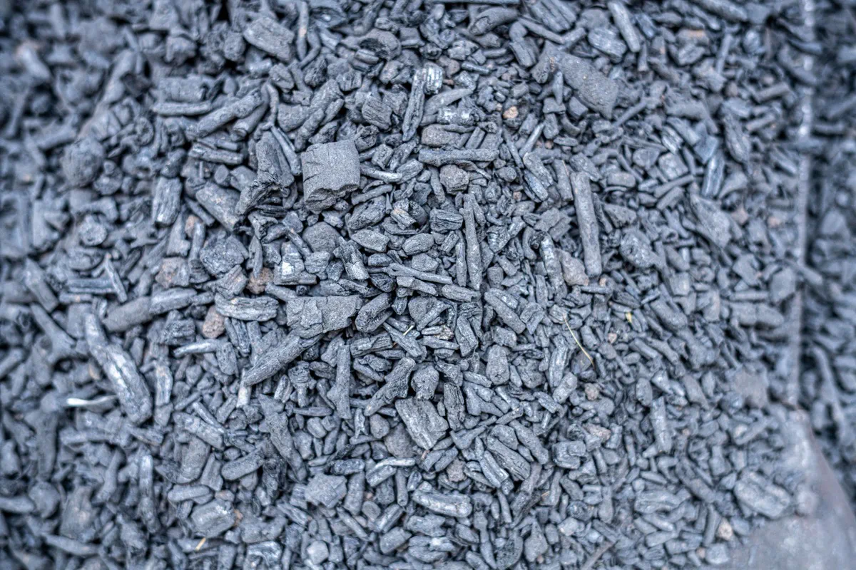 Close-up of dark loose bulk material suitable for industrial container loading